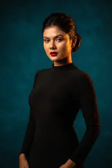 Studio portrait on a turquoise backdrop — an AI-generated example